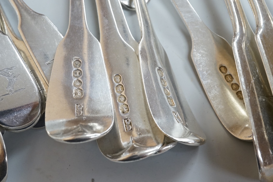A harlequin part canteen of 19th century silver fiddle pattern flatware, comprising twenty six items, all with engraved crest various dates and makers, 32.3oz.
